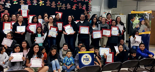 group of students and staff holding awards